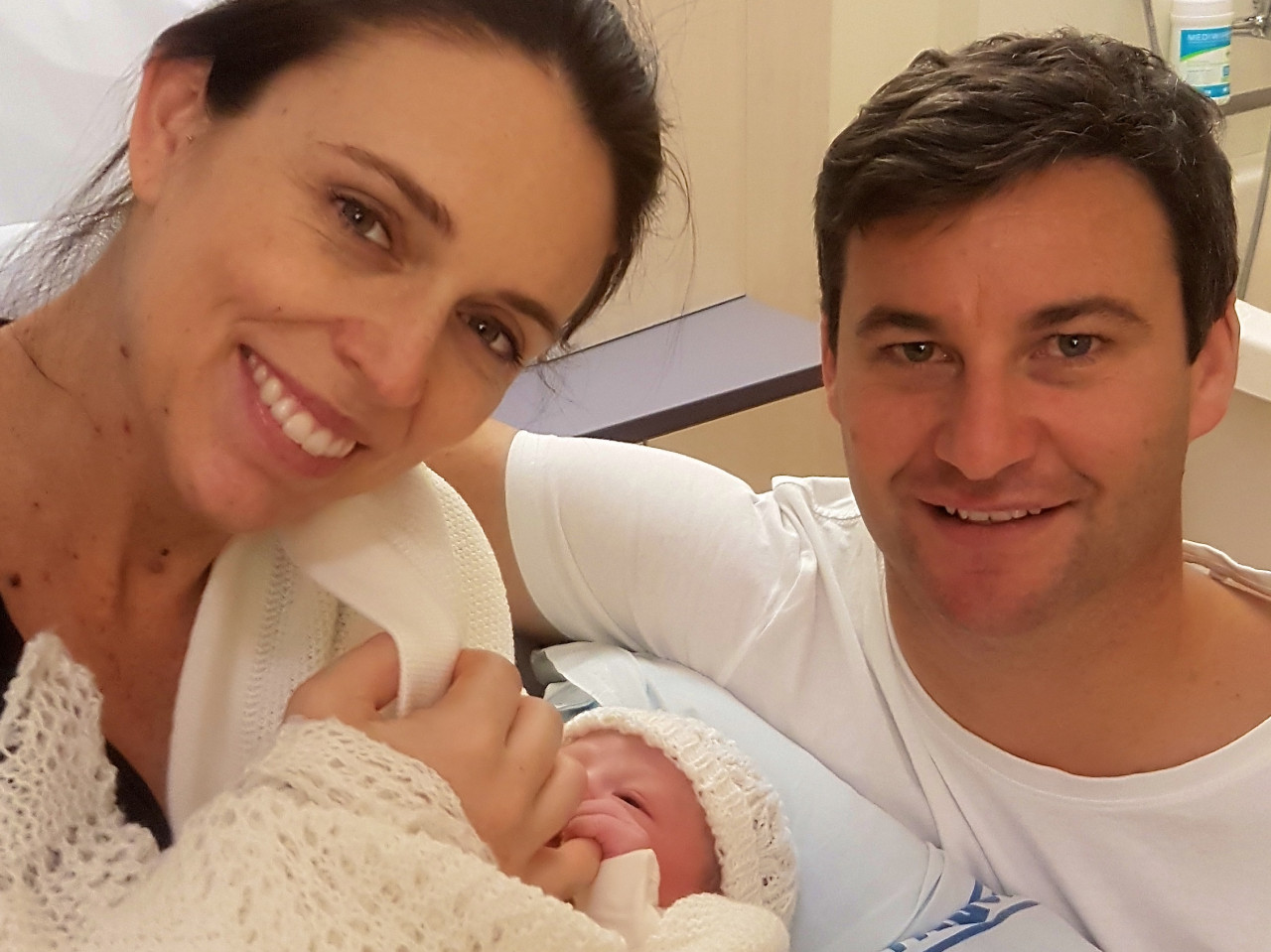AUCKLAND, NEW ZEALAND - JUNE 21: In this handout image provided by Office of the Prime Minister of New Zealand, New Zealand Prime Minister Jacinda Ardern and partner Clarke Gayford pose for a photo with their new baby girl on June 21, 2018 in Auckland, New Zealand.  The baby was born at 4.45pm Tuesday June 21 2018 at Auckland Public Hospital. She weighs 3.31 kgs. The child is the first for Jacinda Ardern and her partner Clarke Gayford. (Photo by Office of the Prime Minister of New Zealand via Getty Images)